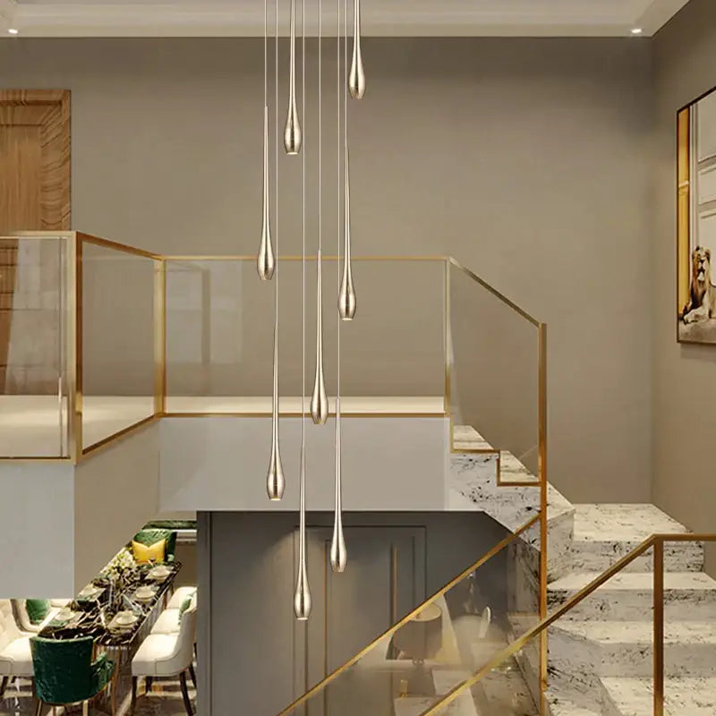 Modern silver teardrop pendant lights complement decorbites gold-plated led chandelier for elegant living room decor