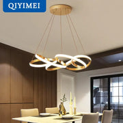 Modern gold plated led pendant lights featuring a gold-toned circular ring chandelier with intertwined design lighting