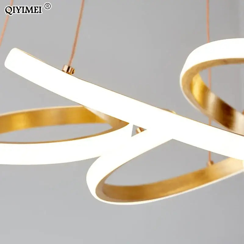 Modern gold plated led pendant lights featuring sleek white and gold rings in a minimalist dining room chandelier decorbites gold plated