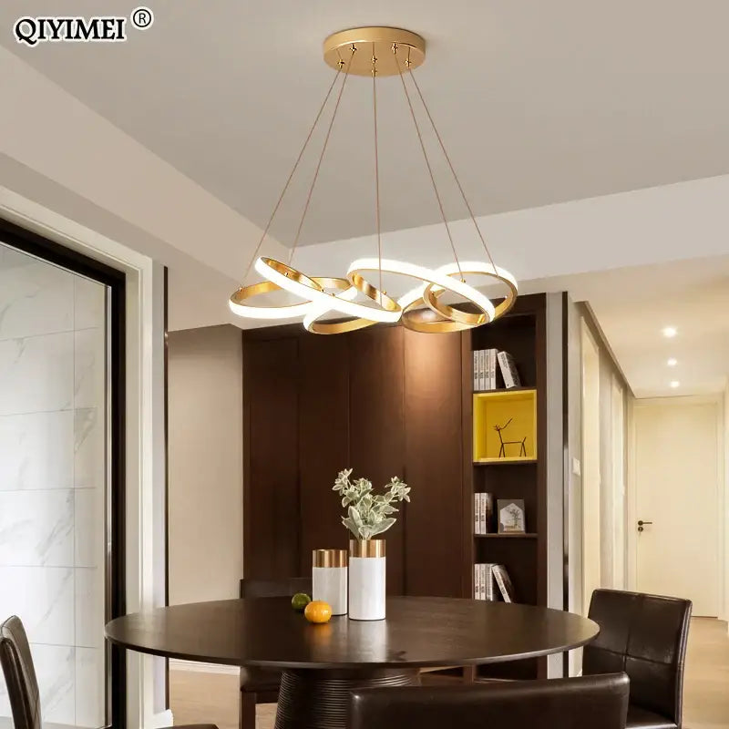 Modern gold plated led pendant lights featuring illuminated gold-toned circular ring chandelier for dining room decorbites gold plated