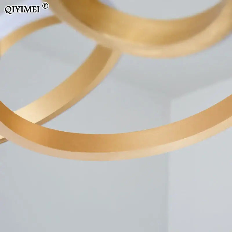 Modern gold plated led pendant lights dining room ring chandelier with gold-colored circular design and sleek metallic finish