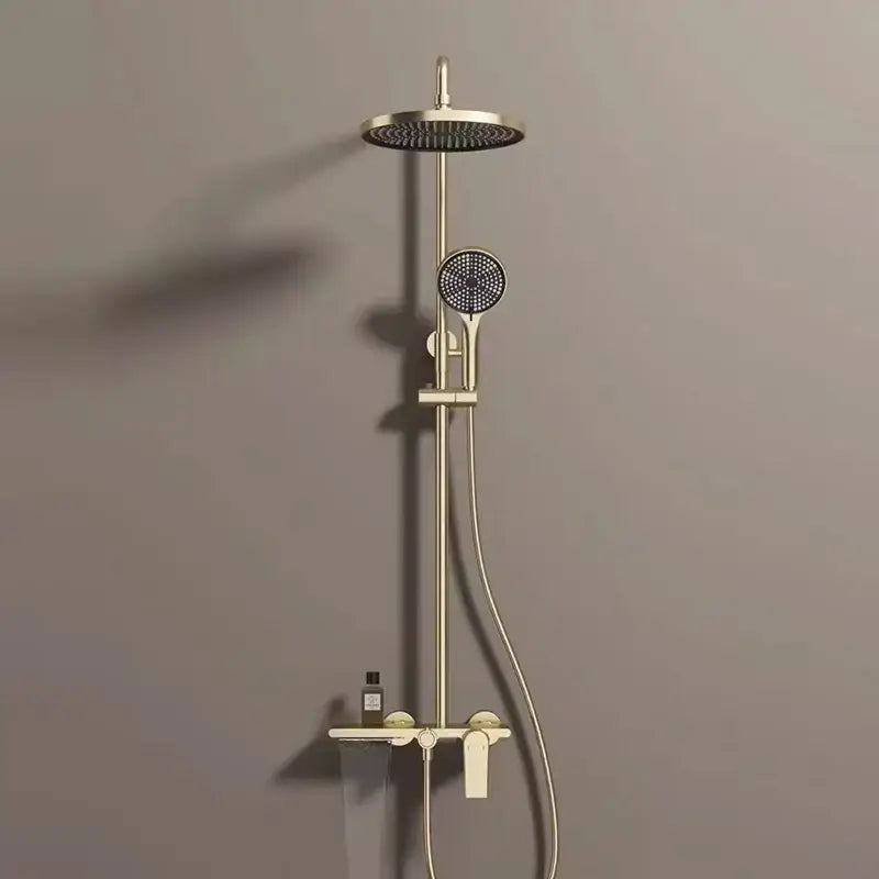 Modern gold rainfall shower set with brass finish featuring a round rainhead and handheld nozzle bathroom shower