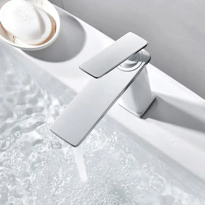 Modern chrome-finished basin faucet with sleek rectangular spout and handle, ideal for decorbites brass basin use