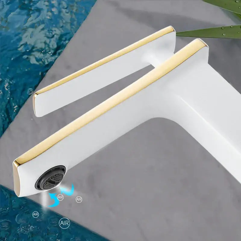 Modern gold rectangular brass basin faucet featuring a sleek white and gold decorbites brass basin design