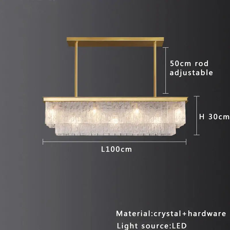 A modern gold rectangular decorbites crystal glass ceiling chandelier with cascading textured clear crystals for dining room decor