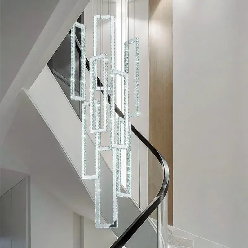 Modern gold rectangular crystal led pendant light with cascading frames suspended above stairs by Decorbites crystal led