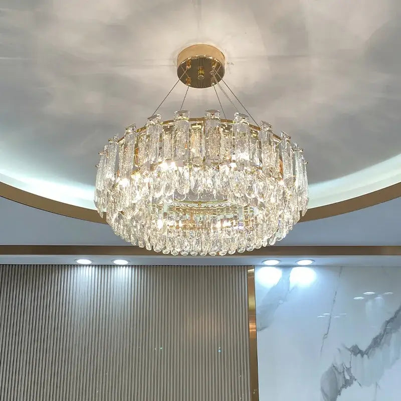 Modern gold rectangular crystal pendant chandelier featuring a two-tiered decorbites crystal pendant with glass prisms