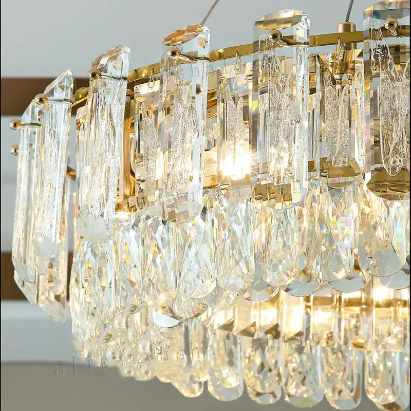 Modern gold rectangular crystal pendant chandelier with cascading clear prisms and teardrop droplets for dining room decorbites crystal pendant