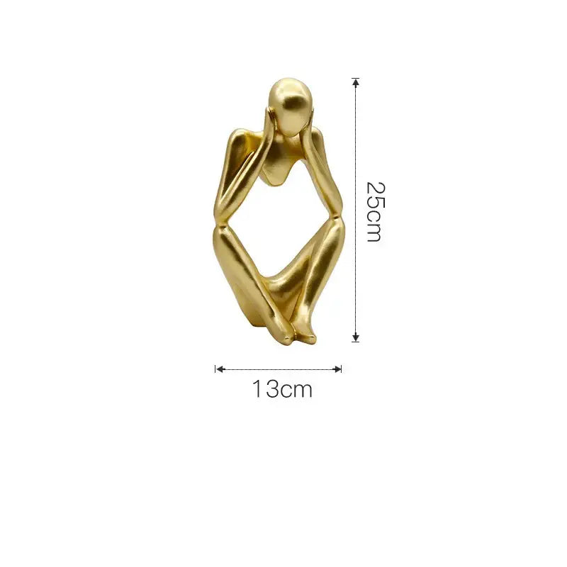 Modern gold resin sculpture of a seated human figurine in contemplative pose by decorbites gold resin decorbites gold