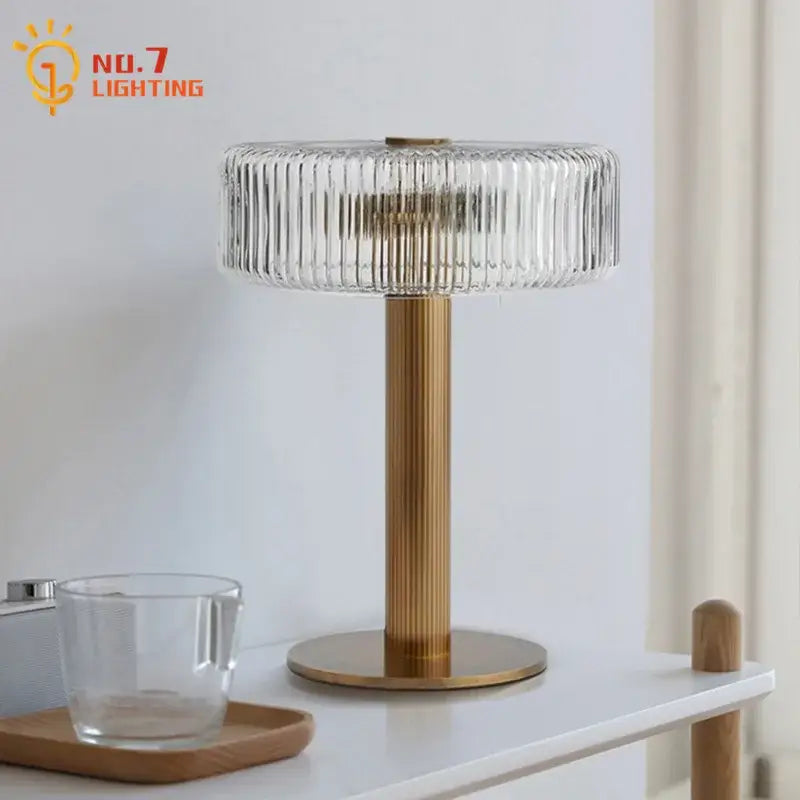 Modern gold ribbed glass table lamp with clear ribbed glass shade and brushed gold metal base for bedroom decorbites glass table lamp