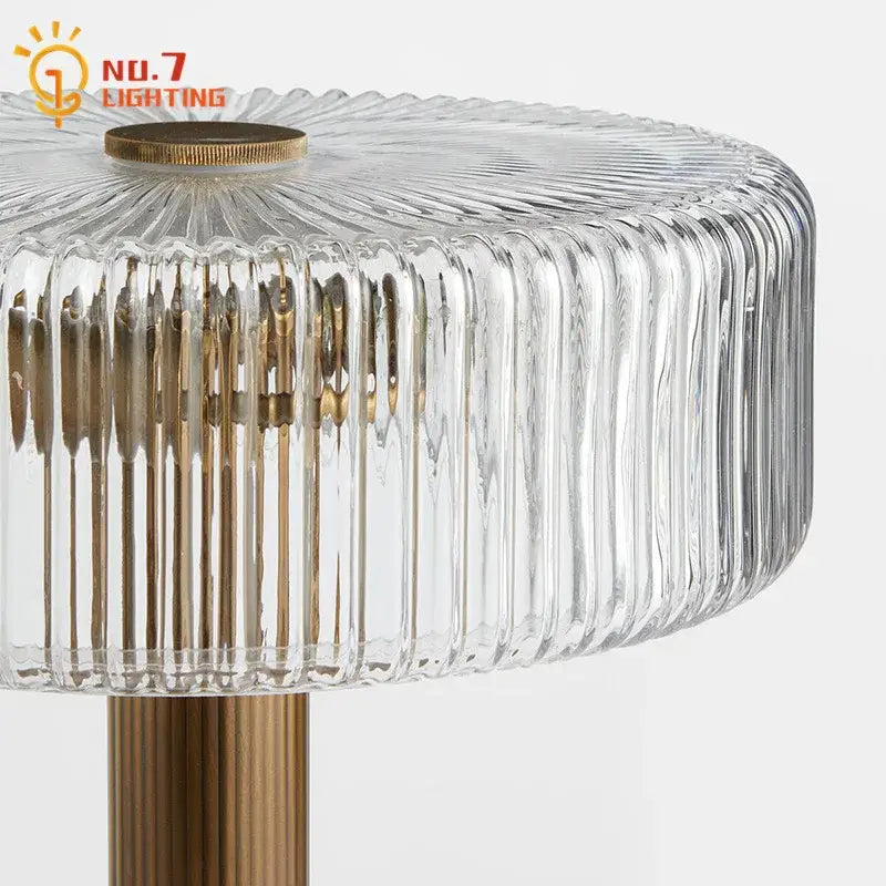 Modern gold ribbed glass table lamp with clear vertical ridged glass lampshade and brass-colored metal base decorbites glass table lamp