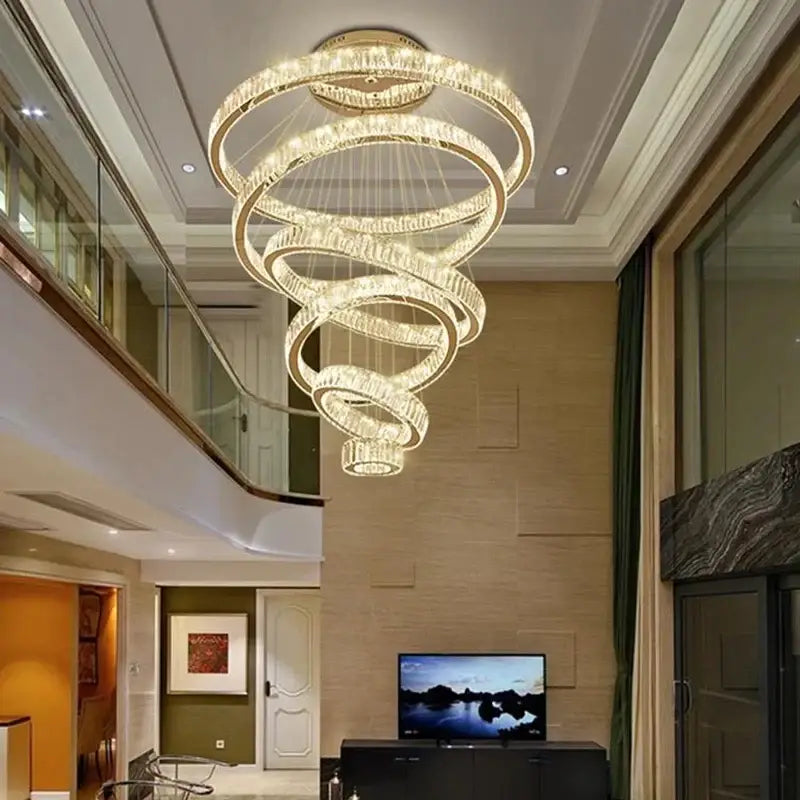 A modern gold decorbites crystal led chandelier with spiral concentric rings and warm LED lights for living room use