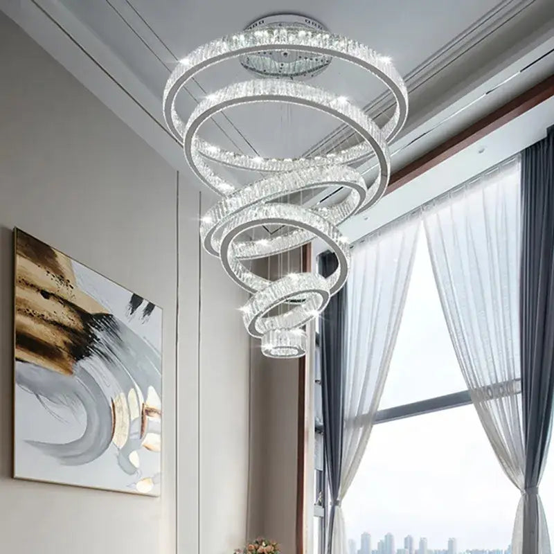 A modern gold decorbites crystal led chandelier with spiral clear crystal rings and polished metal for living room light