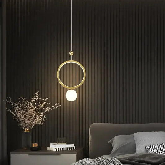 Modern gold ring led pendant light featuring a gold-toned circular design with a spherical bulb for kitchen island decorbites gold ring