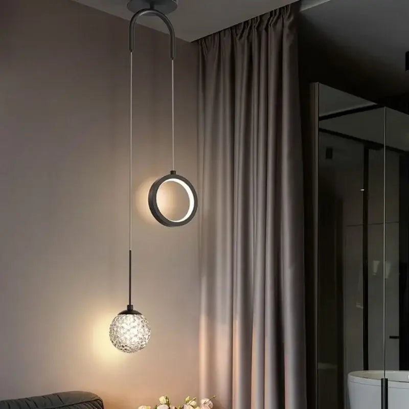 Modern pendant light with a sleek black ring and textured crystal globe decorbites gold ring led for living room decor