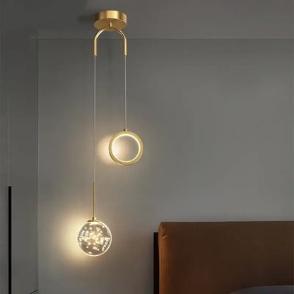 Modern gold ring led pendant light with crystal features a sleek circular fixture and glowing ring and globe for decorbites gold ring decor