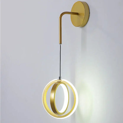 Modern gold ring led wall lamp with two concentric circular rings and soft white glow for bedroom or living room