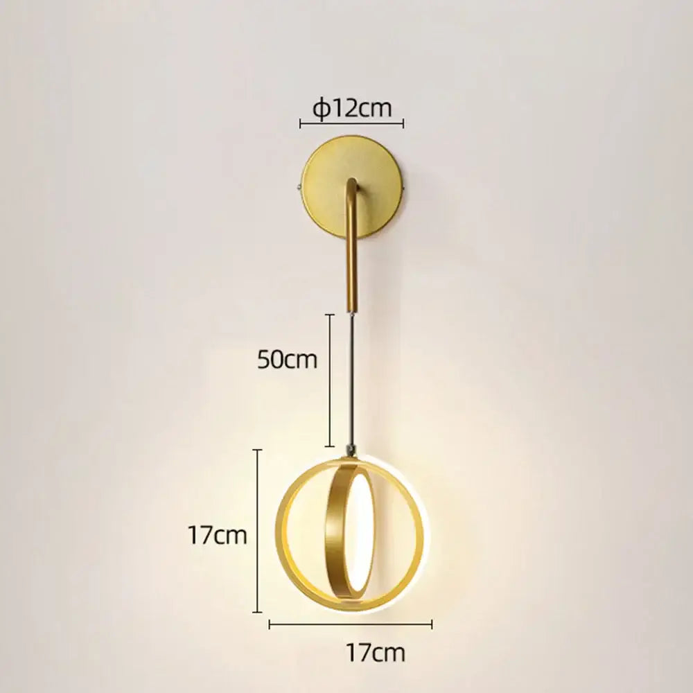 Modern gold ring led wall lamp with circular light and sleek cylindrical stem for bedroom and living room use