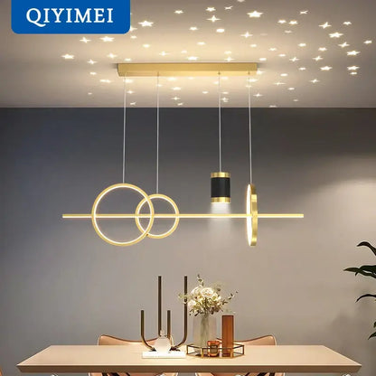 Modern gold ring pendant light with intersecting circular rings and central cylinder for dining room decorbites black nordic style pendant lights