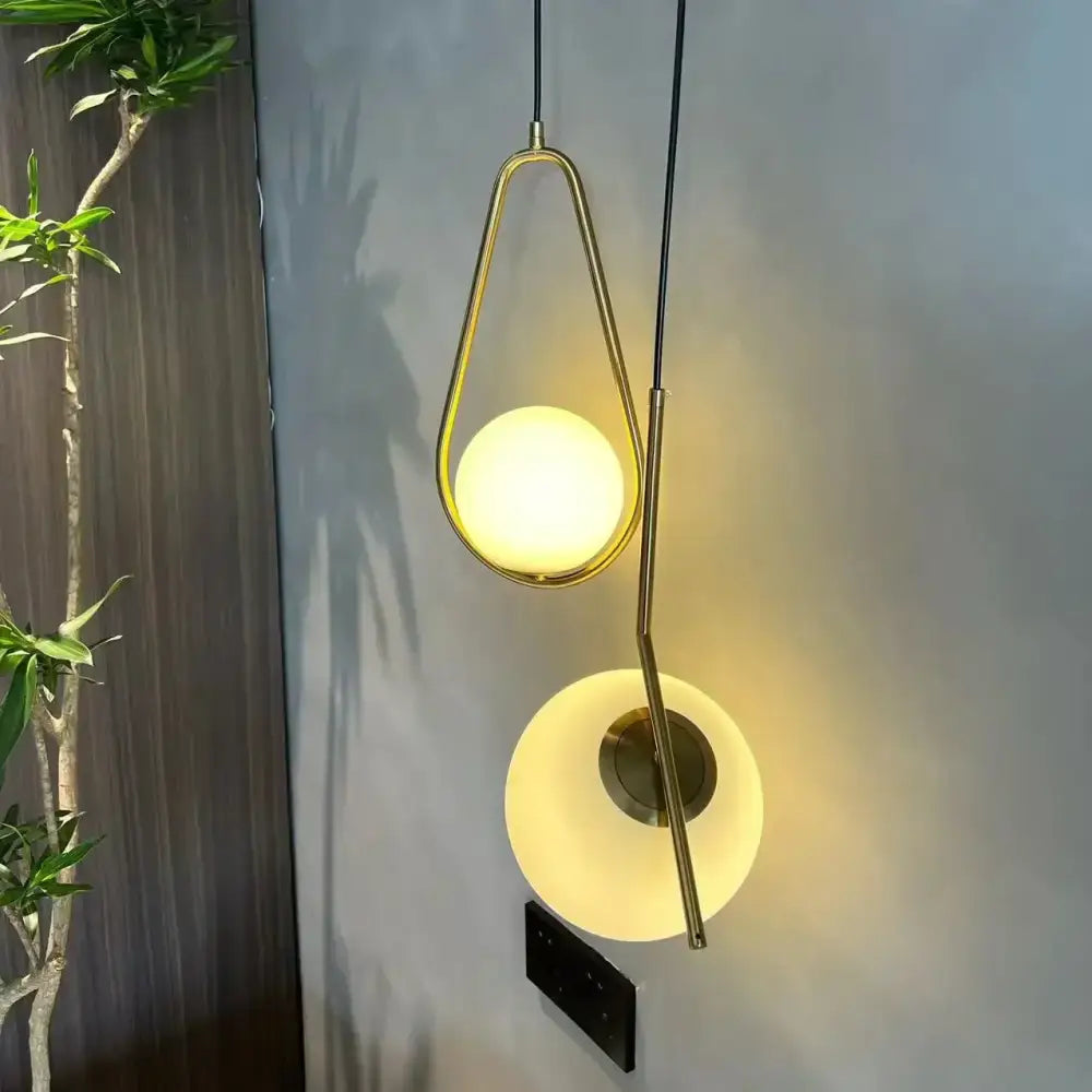 Modern gold ring pendant light featuring gold-toned metal frames and frosted glass globes for living room decorbites gold ring