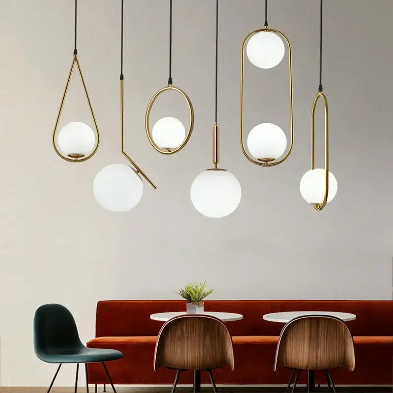 Modern gold ring pendant light with brass fixture and frosted glass globes for elegant living room decorbites gold ring design