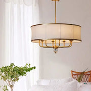 Modern gold rod led chandelier with gold-toned frame, cylindrical off-white fabric shade, and crystal accent for living room decorbites gold rod