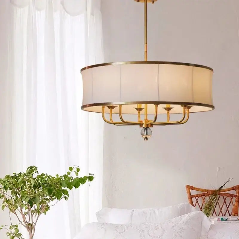 Modern gold rod led chandelier with gold-toned frame, cylindrical off-white fabric shade, and crystal accent for living room decorbites gold rod