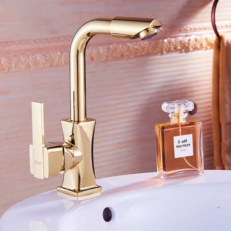 Modern gold brass basin faucet with single-handle sleek curved spout and square base for bathroom decorbites brass basin