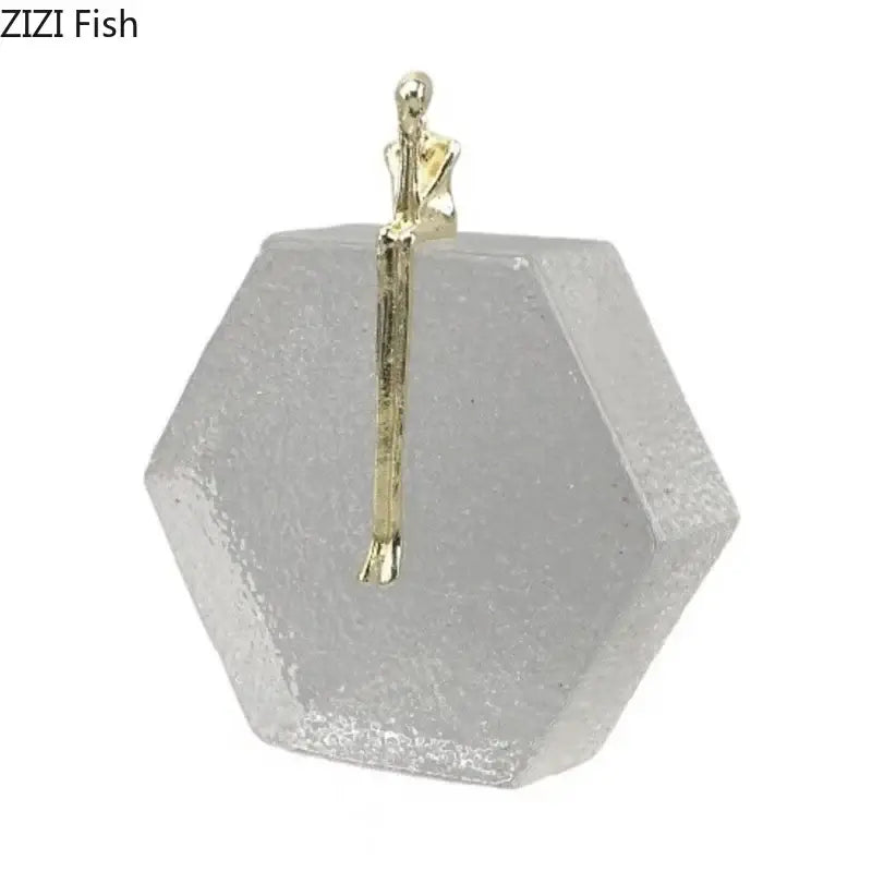 Modern gold runner crystal sculpture abstract statue featuring a gold-toned figurine on a hexagonal glass base decorbites crystal sculpture