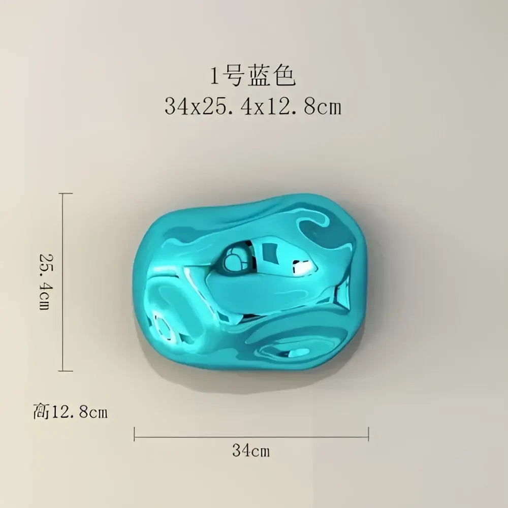 Glossy vibrant blue irregular plastic wall ornament with smooth reflective surface for modern stone wall decor