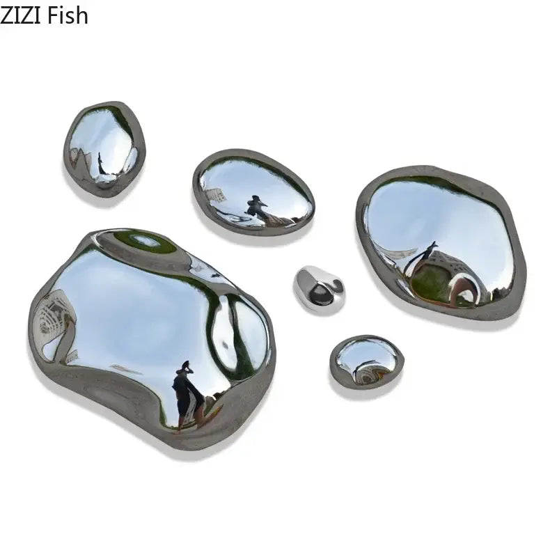 Modern gold and silver 3d stone wall ornaments featuring shiny metallic reflective stone wall decor pieces in various sizes and shapes