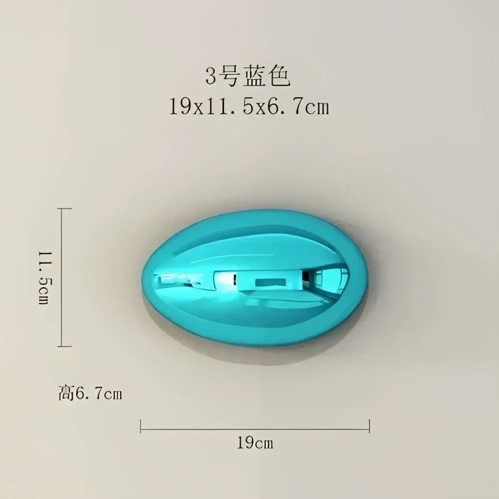 A sleek oval turquoise plastic device with visible internal components for modern gold and silver 3d stone wall ornaments