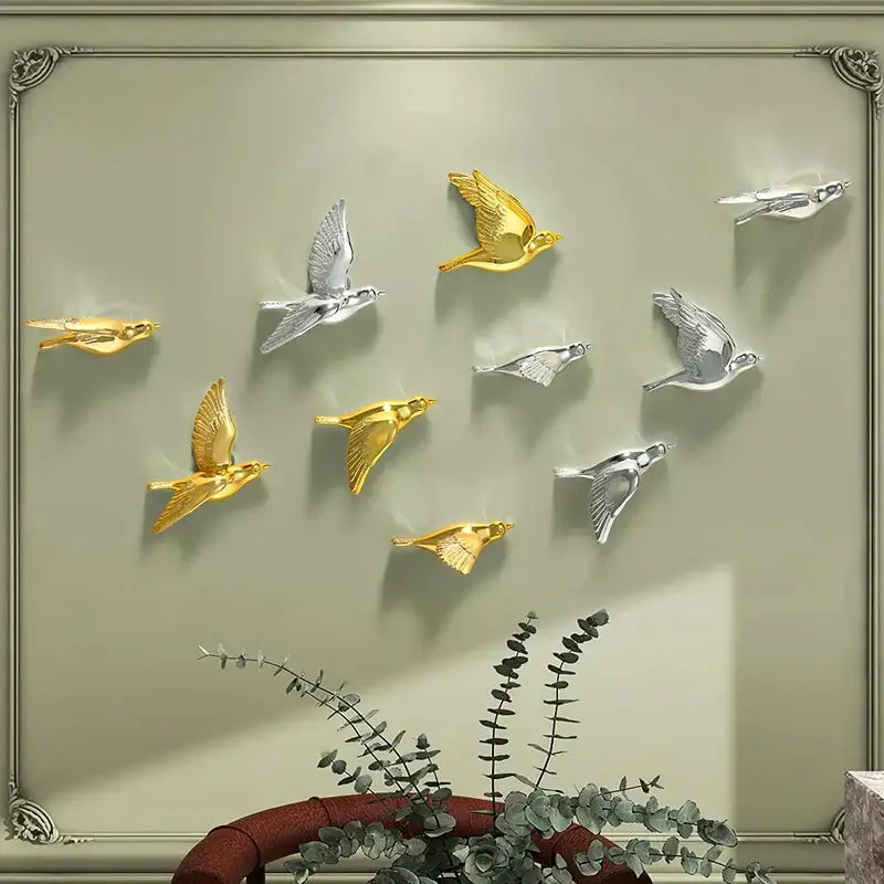 Modern gold and silver bird resin statue wall decor with detailed sculpted wings for children’s room display