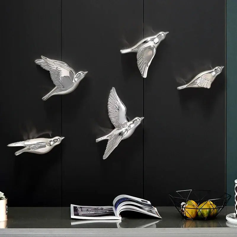Silver metallic bird resin statue wall decor in mid flight pose for modern children’s room decoration