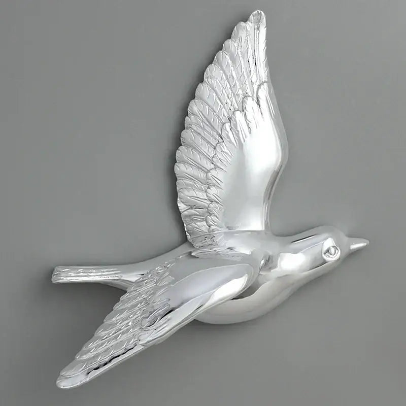 Silver metallic bird resin statue wall decor with detailed feather textures and polished reflective finish for children’s room