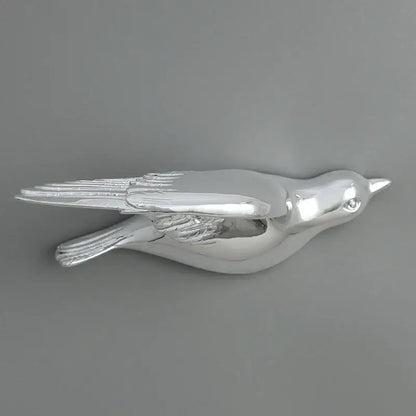 Silver bird resin statue wall decor with polished metallic finish and detailed feather textures for children’s room