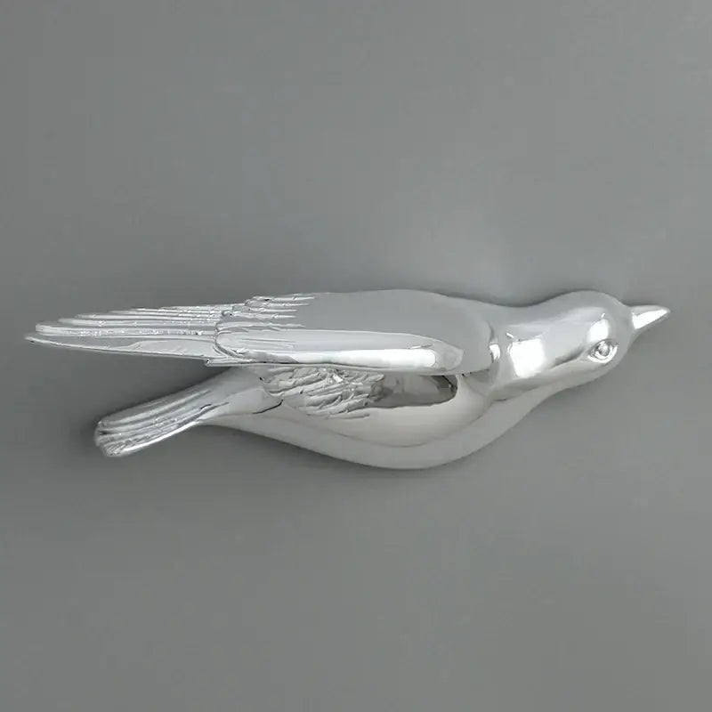 Silver bird resin statue wall decor with polished metallic finish and detailed feather textures for children’s room