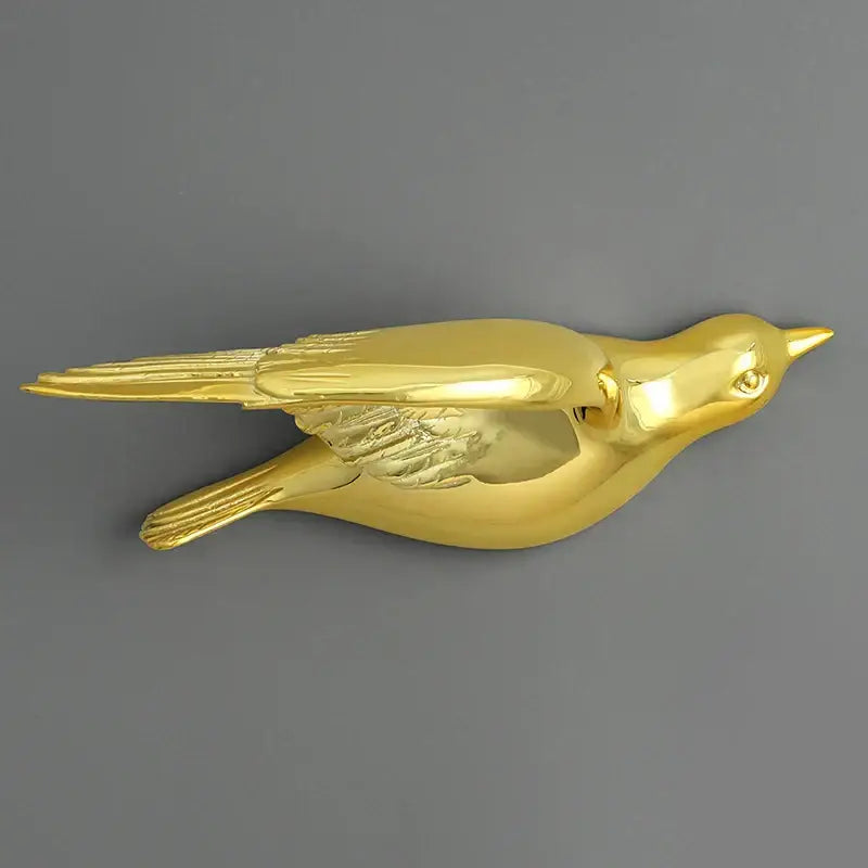 Modern gold bird resin statue wall decor with sleek polished finish and detailed feather textures for children’s room