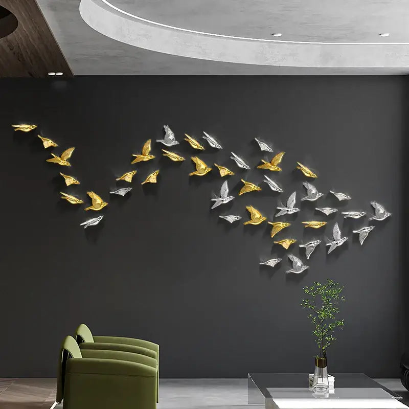 Modern gold and silver bird resin statue wall decor featuring metallic birds flying on dark gray surface for children’s room
