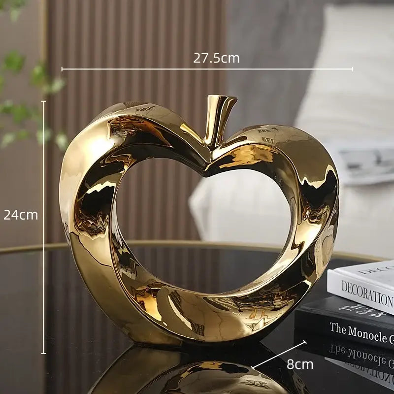 Shiny gold ceramic golden apple sculpture decorative living room accent with modern design and glossy finish