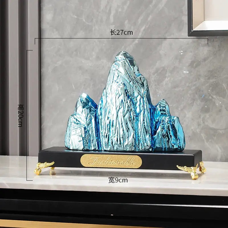 Modern gold and silver decorbites ceramic mountain sculpture in shiny blue with gold accents and black base for living room decor