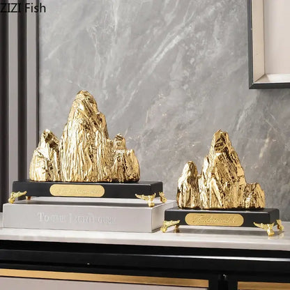 Modern gold and silver decorbites ceramic mountain sculpture with textured surfaces on black bases for living room decor
