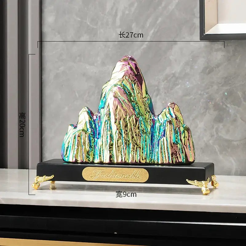 Modern gold and silver ceramic mountain sculpture decorbites iridescent finish on black base with gold accents for living room decor