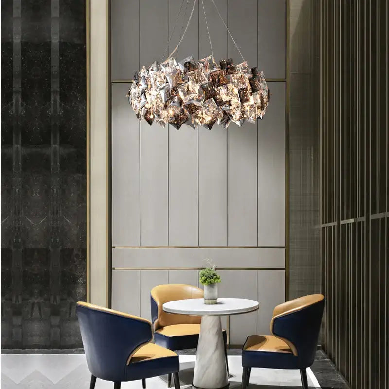 Modern gold and silver crystal dimmable led chandelier with metallic leaf decor for dining room by DecorBites