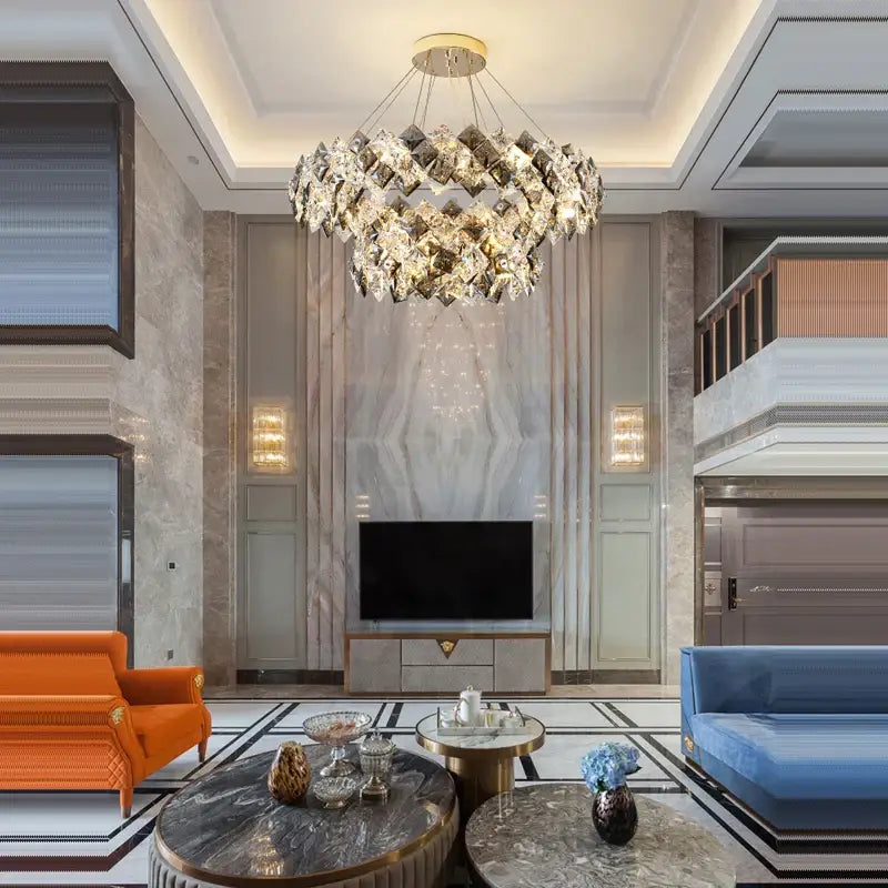A modern gold and silver decorbites crystal dimmable led chandelier with faceted crystals for dining room decor
