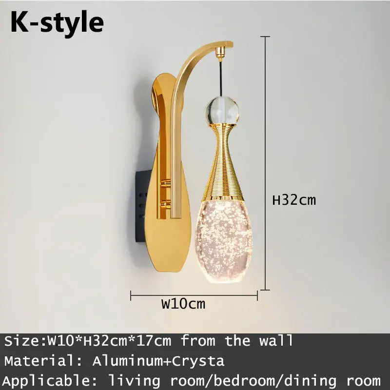 Modern gold and silver crystal led wall sconce with a gold-toned aluminum arm and faceted decorbites crystal led pendant