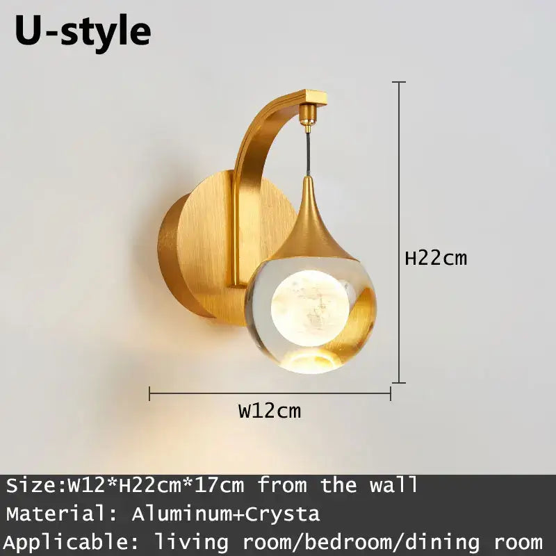 Modern gold and silver decorbites crystal led wall sconce with curved aluminum arm and clear crystal globe light