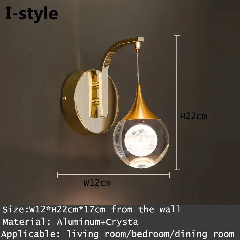 Modern gold and silver crystal led wall sconce with curved aluminum arm and clear globe for bedroom decorbites crystal led