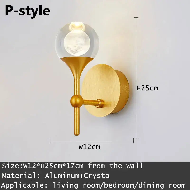 Modern gold and silver crystal led wall sconce bedroom light with a gold-toned aluminum base and clear glass globe decorbites crystal led