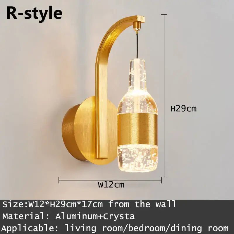 Modern gold and silver crystal led wall sconce with a curved aluminum arm and clear crystal bottle lampshade decorbites crystal led